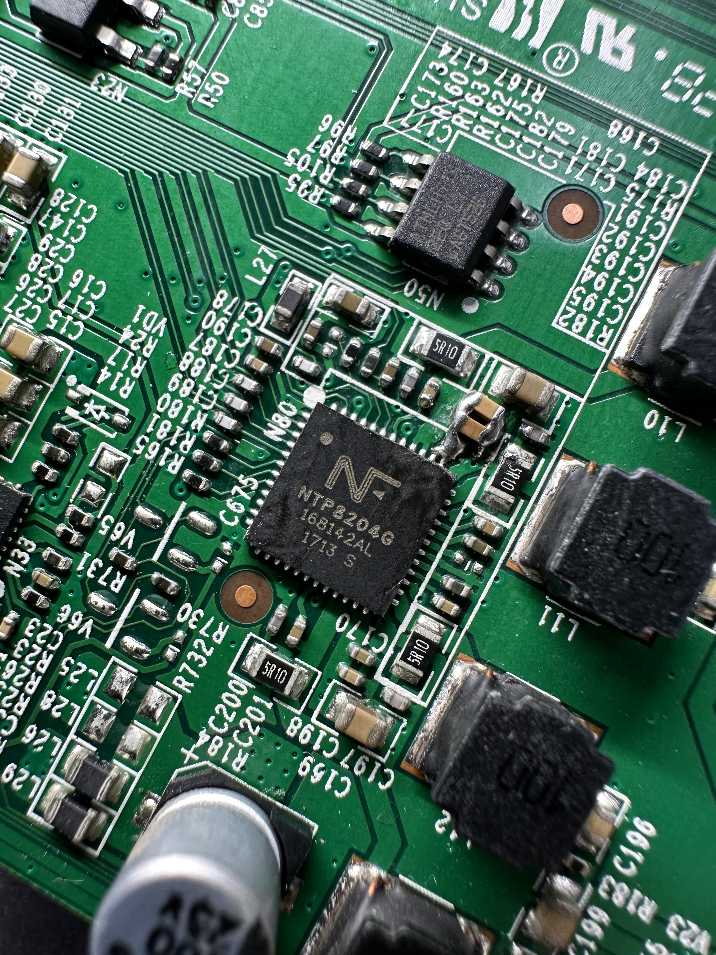 Close-up of a TV circuit board being repaired at Eastcoast Electronics